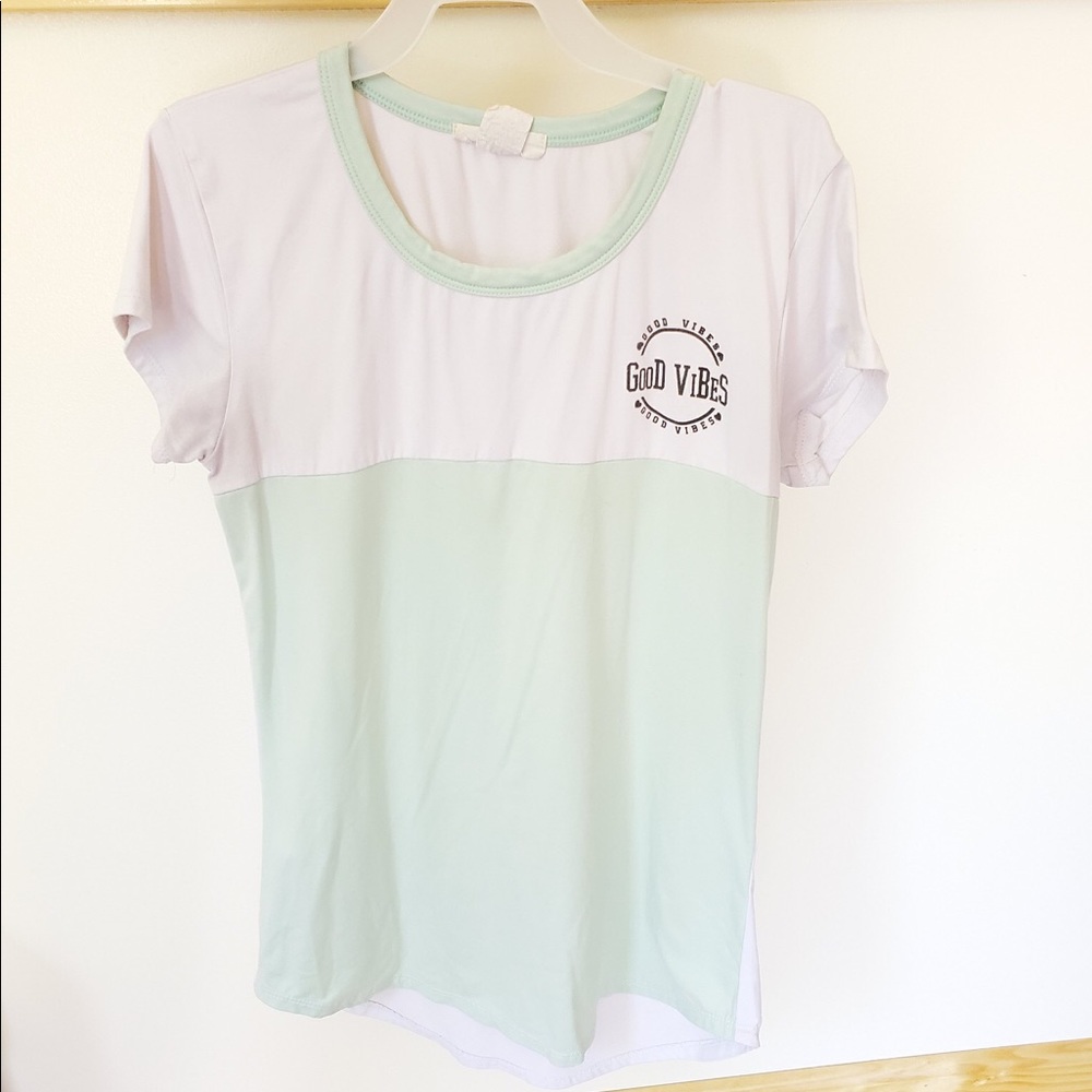 I’m selling a “good vibes” t-shirt by Marci.